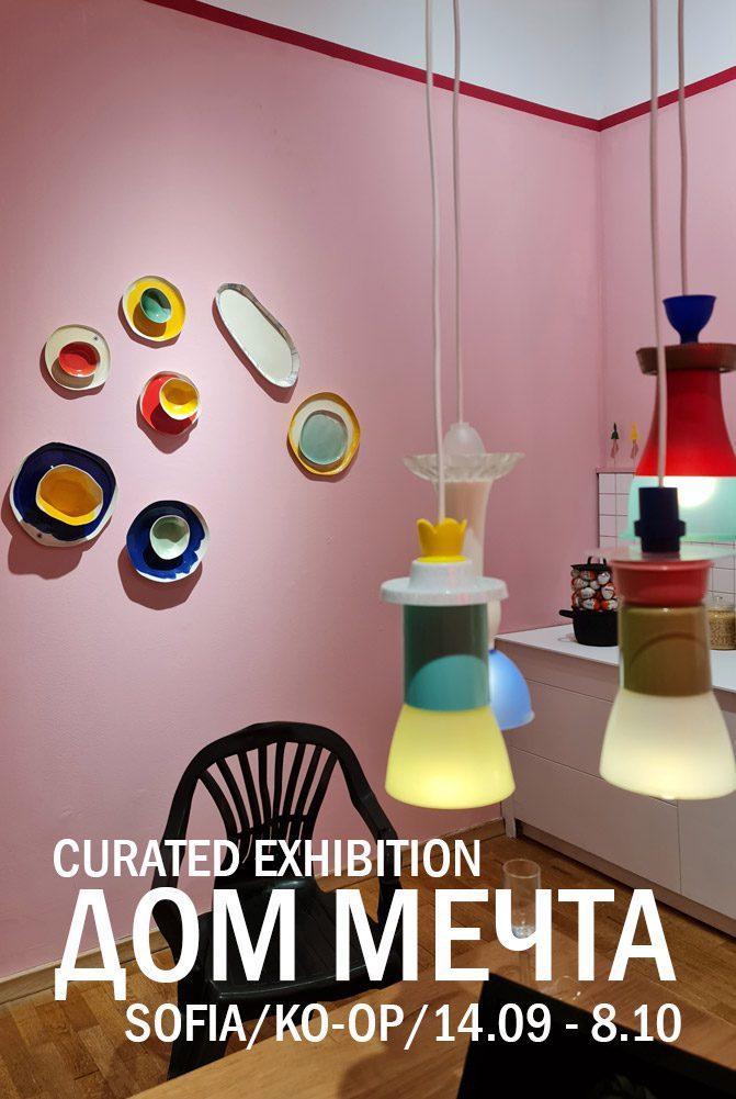 Dream Home curated exhibition in Sofia with colourful handmade porcelain plates on a pink wall
