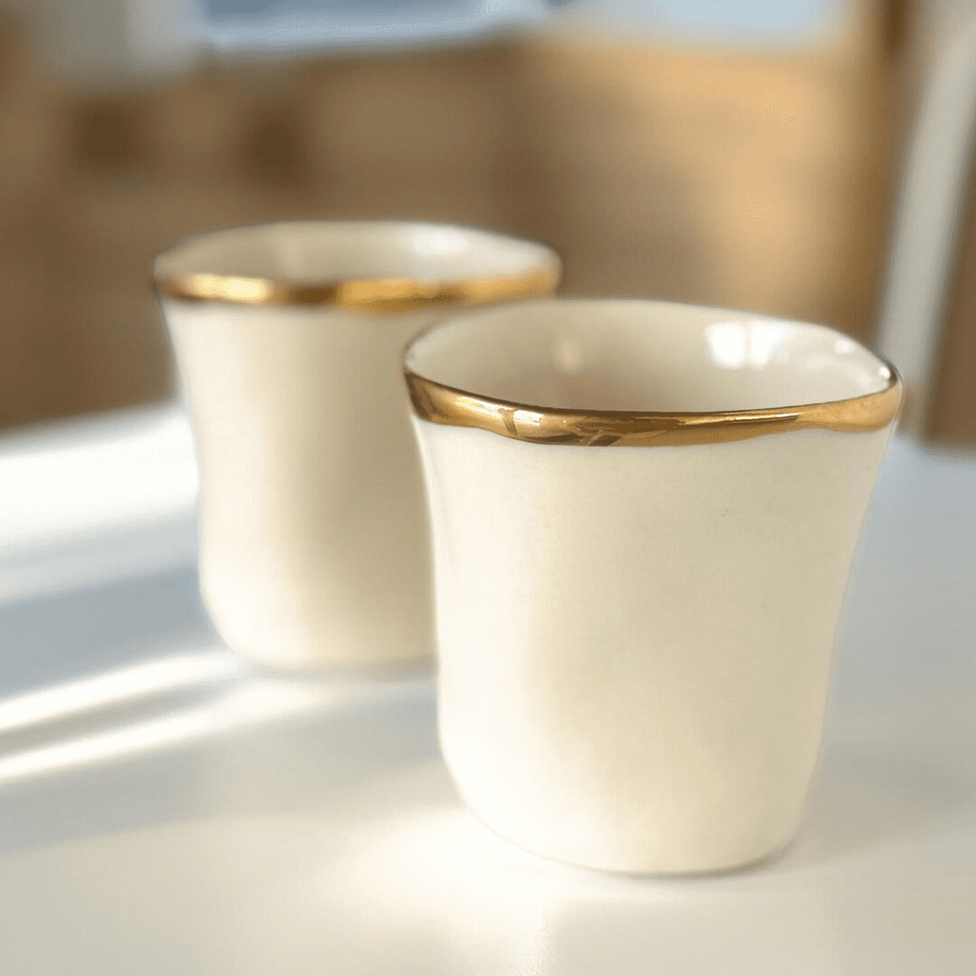 Handmade white porcelain cups with hand-painted gold rim, set of 2