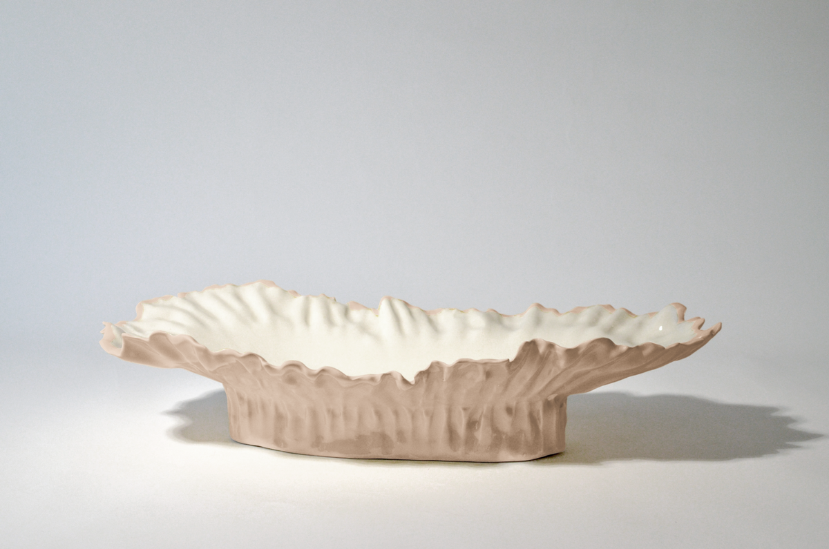 Blossom elevated serving bowl with a pale pink rippled exterior and white interior