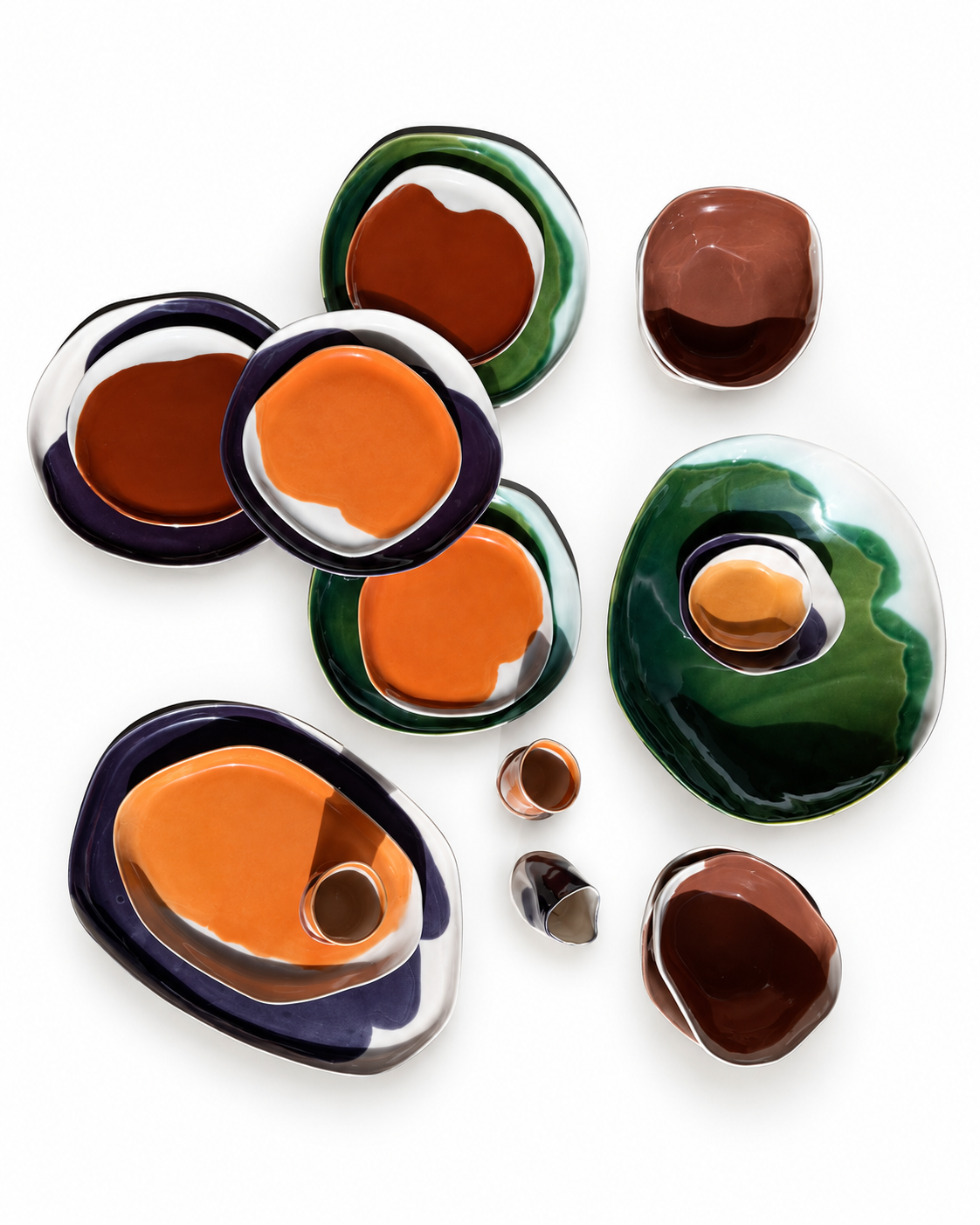 Overhead view of handmade autumn dinner plates, platters and dip bowls