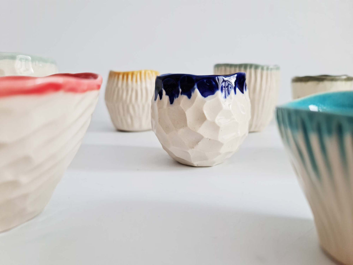 Set of 6 hand-pinched textured porcelain cups with colourful glaze inside