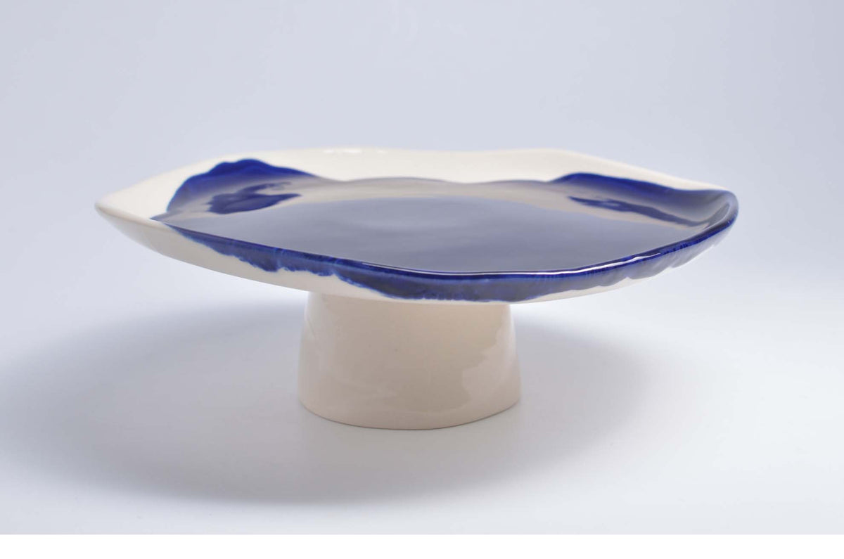 Artistic Cake Stand in white porcelain with a dark blue brushed glaze edge