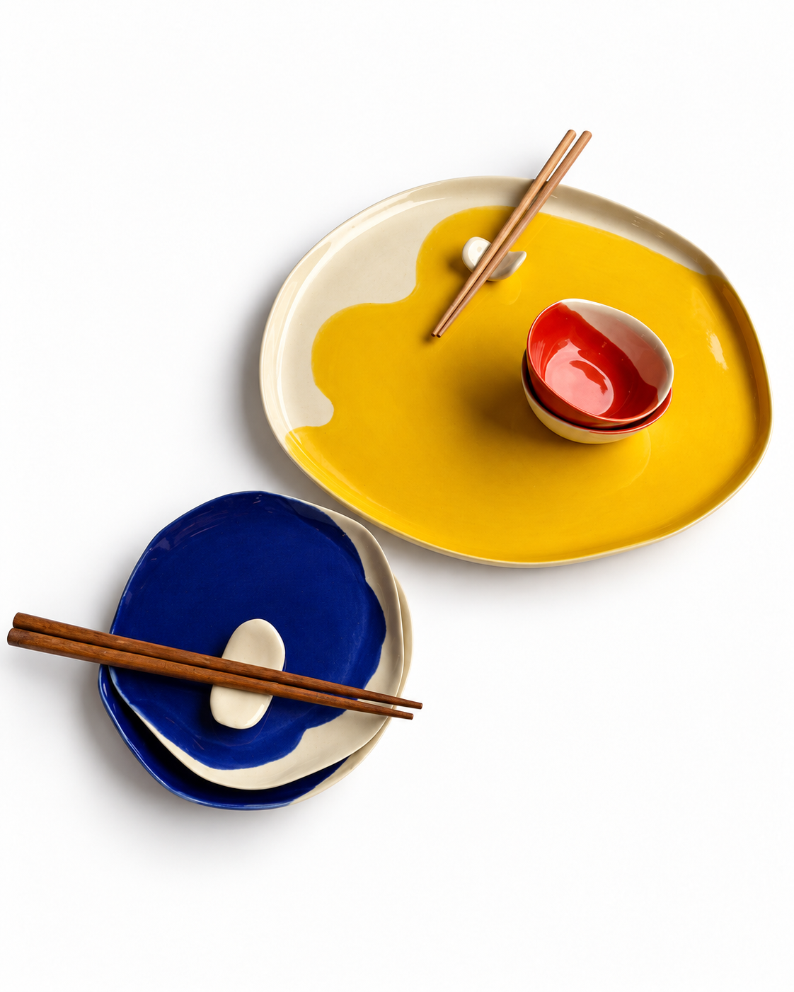 Bauhaus handmade ceramic sushi set for two with a 32 cm cadmium yellow serving plate, 16 cm ultramarine plates, scarlet red dip bowls and ceramic chopstick rests – view 3