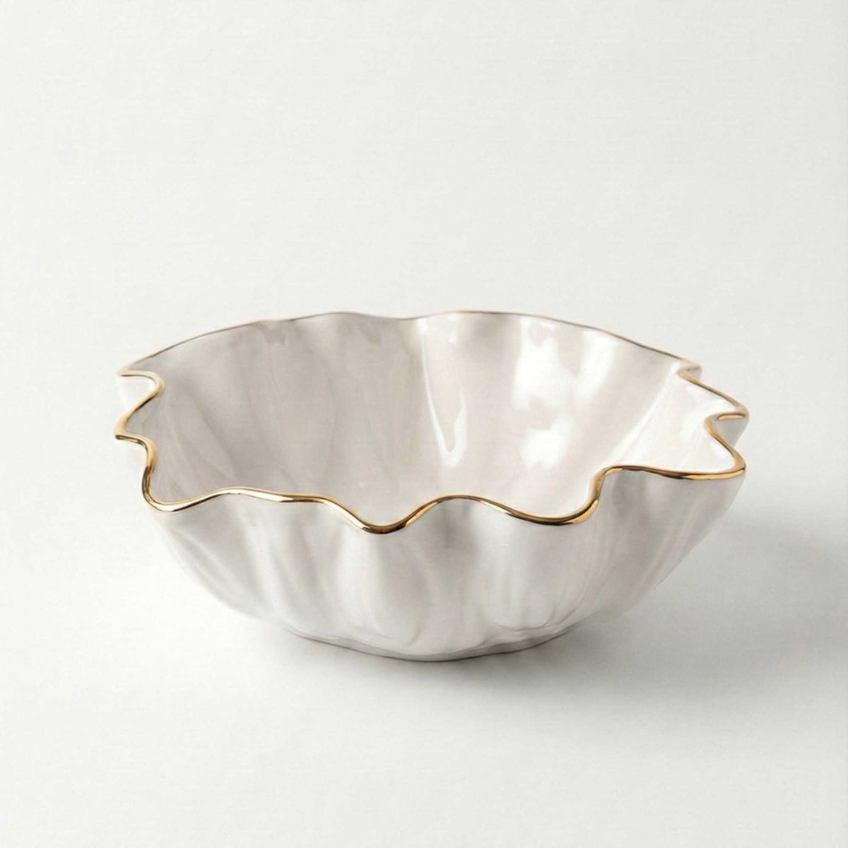 Blossom bowl with copper rim, a wavy white porcelain serving bowl with scalloped edge
