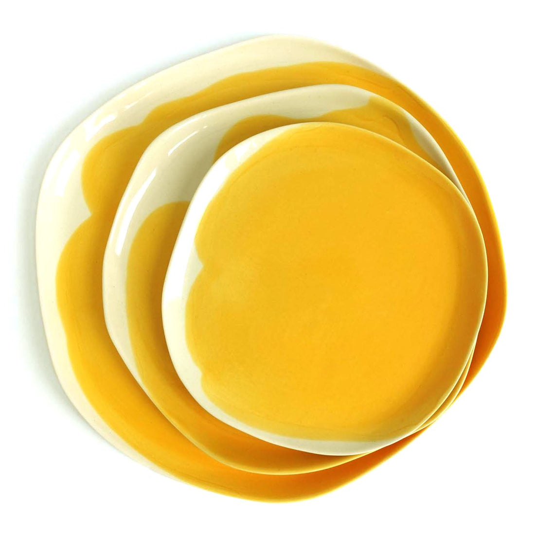 Stack of three handmade porcelain plates in Cadmium Yellow glaze with irregular white rims