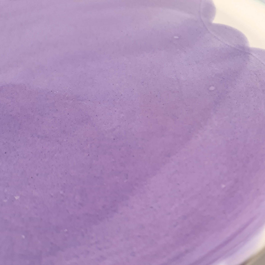 Lavender glossy glaze sample on handmade porcelain with soft brushed tones