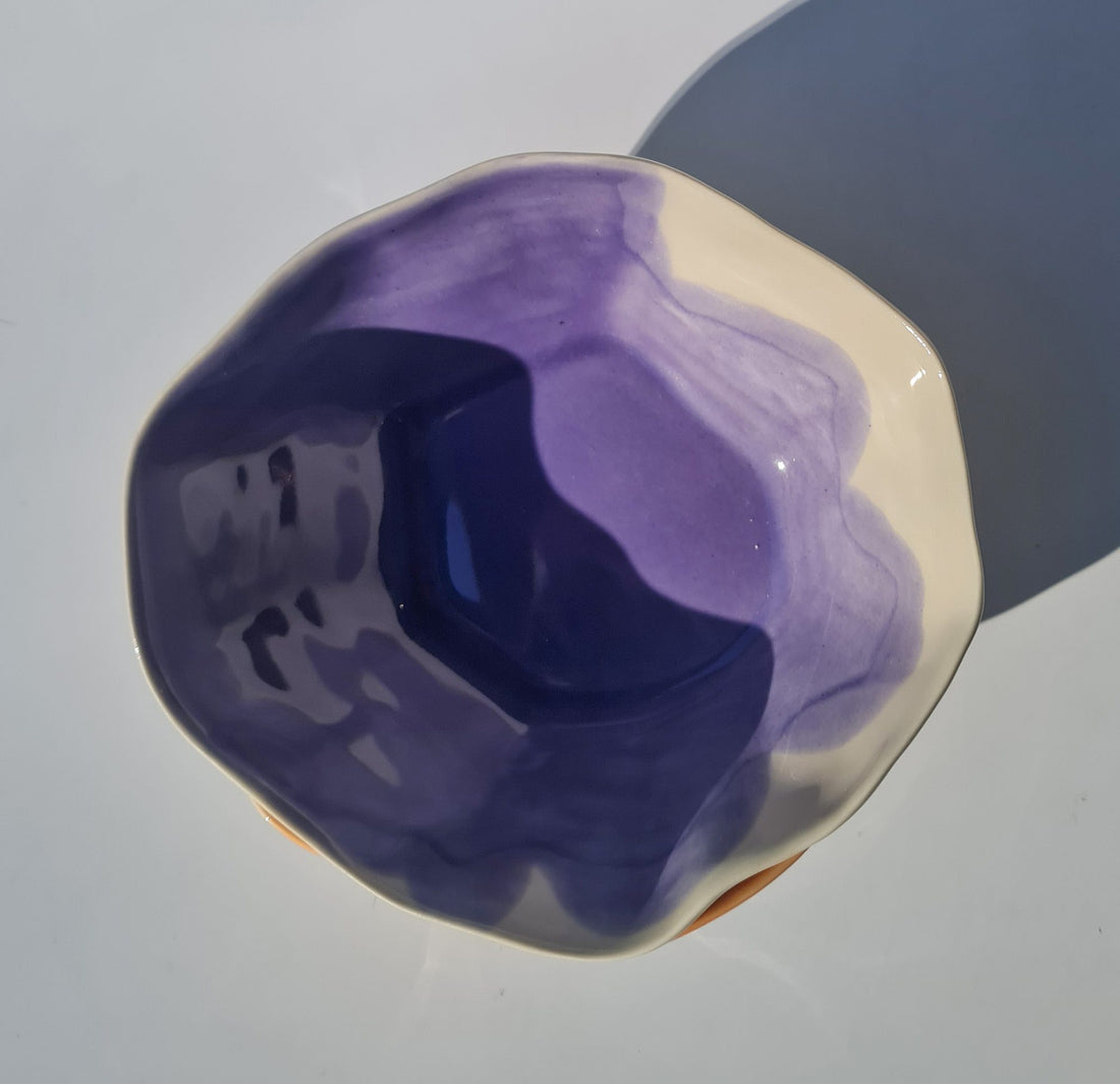 Handmade porcelain ramen bowl in Lavender glaze with an irregular white rim, seen from above