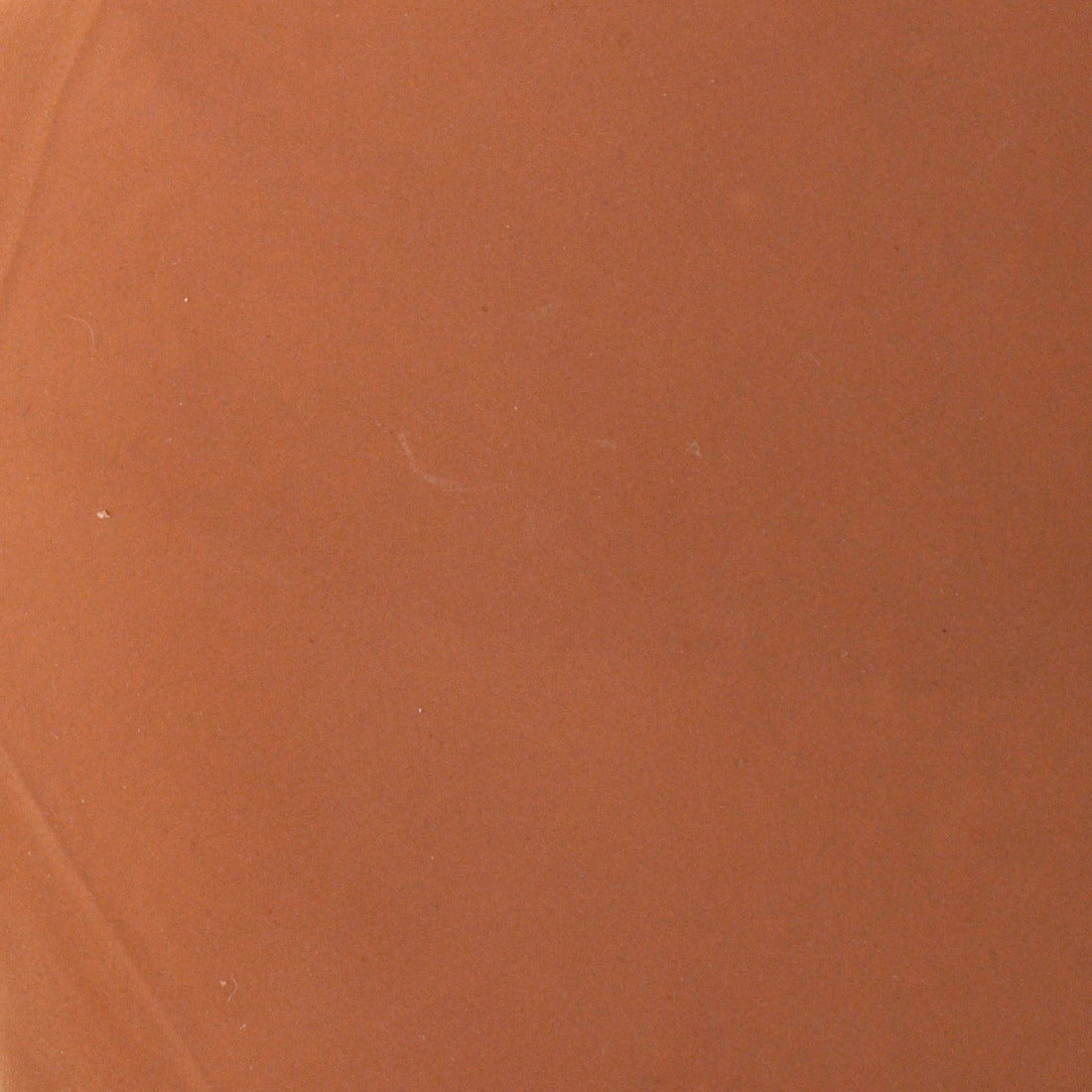 Hazelnut glossy glaze sample on handmade porcelain in a warm caramel brown