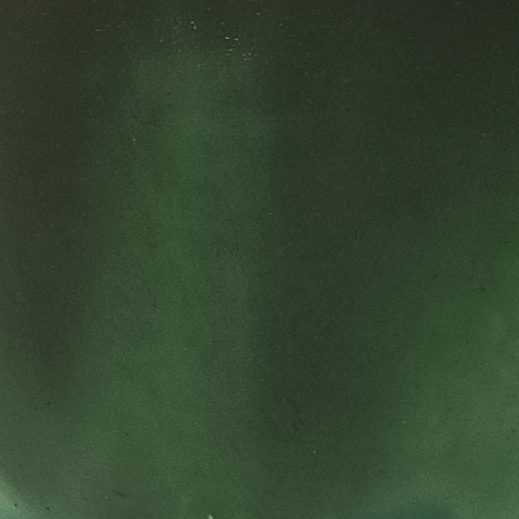 Close-up of deep Forest Green glossy glaze sample on handmade porcelain