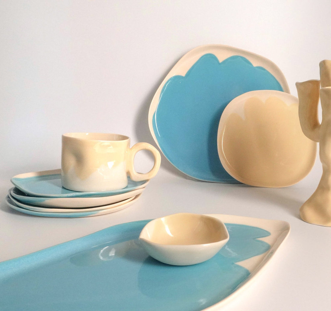 Sky Blue porcelain tray, plates and cream mug from the Color collection on a white table