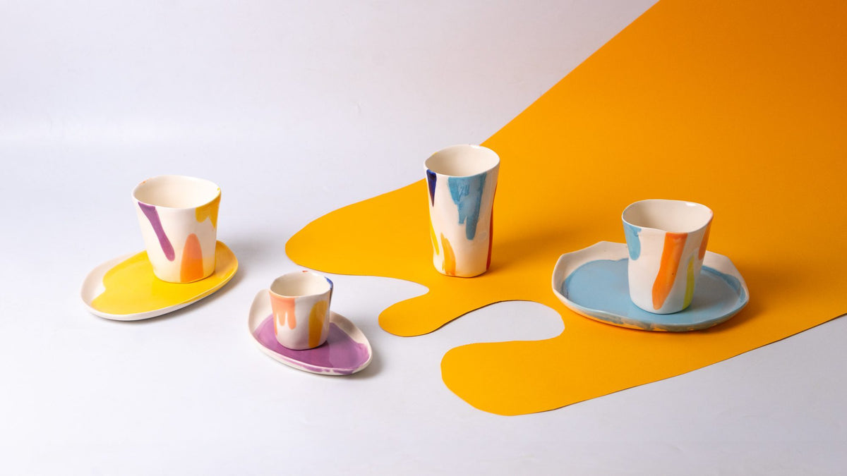 Handmade porcelain espresso cups and saucers in pastel glazes as colourful corporate gifts