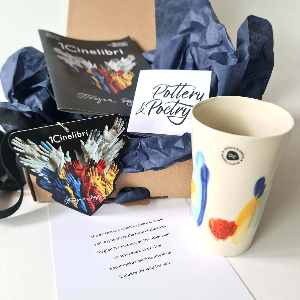 Hand-painted ceramic cup with branded gift packaging and Pottery & Poetry card