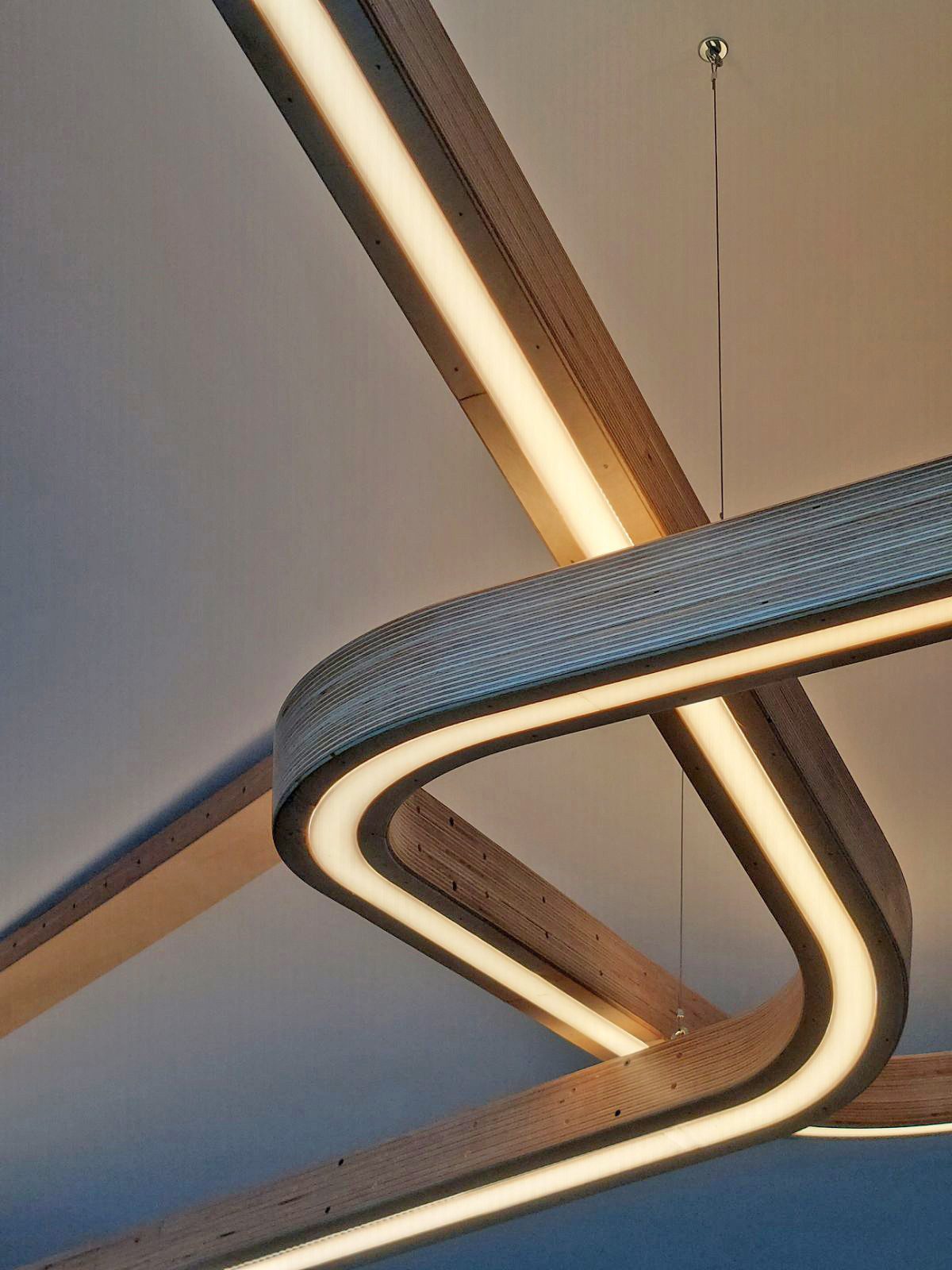 Detail of a curved chair frame and upholstered seat