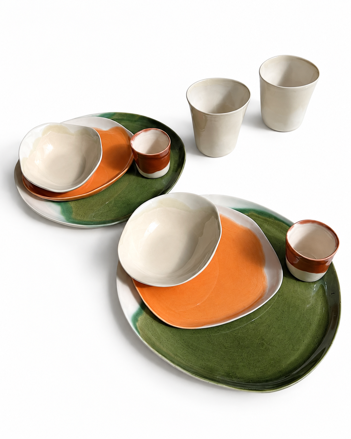 Two Autumn / Winter place settings with plates, bowls and handleless cups