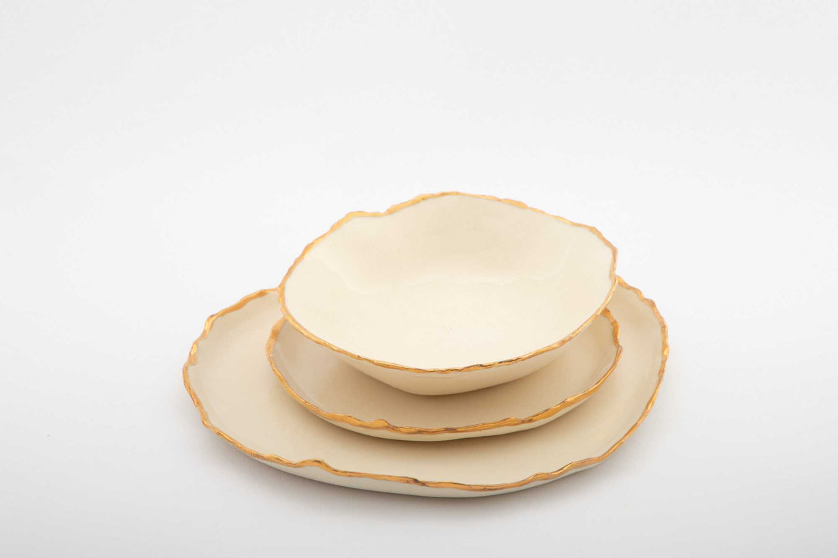 Gilded Ridges three-piece dining set with an ivory bowl and two gold-edged plates
