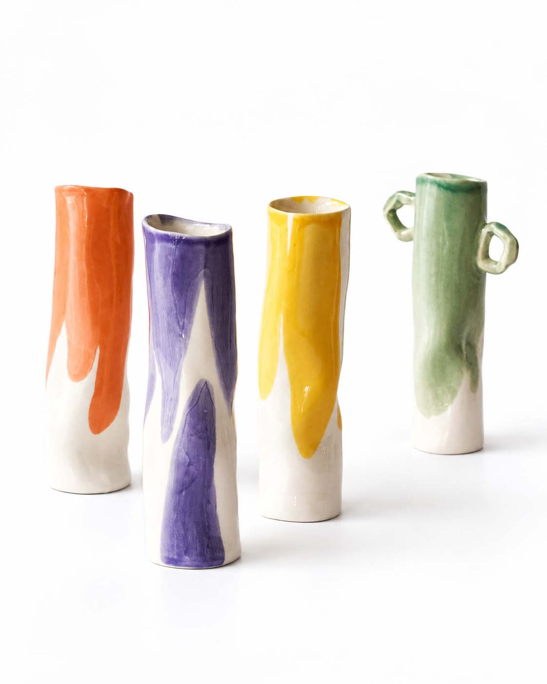 Tall ceramic vases with red, purple, yellow and green glazes