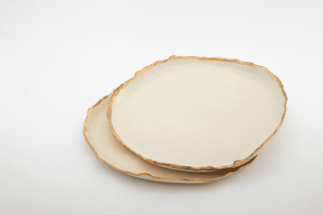 Two ivory Gilded Ridges dinner plates with gold-finished handmade edges