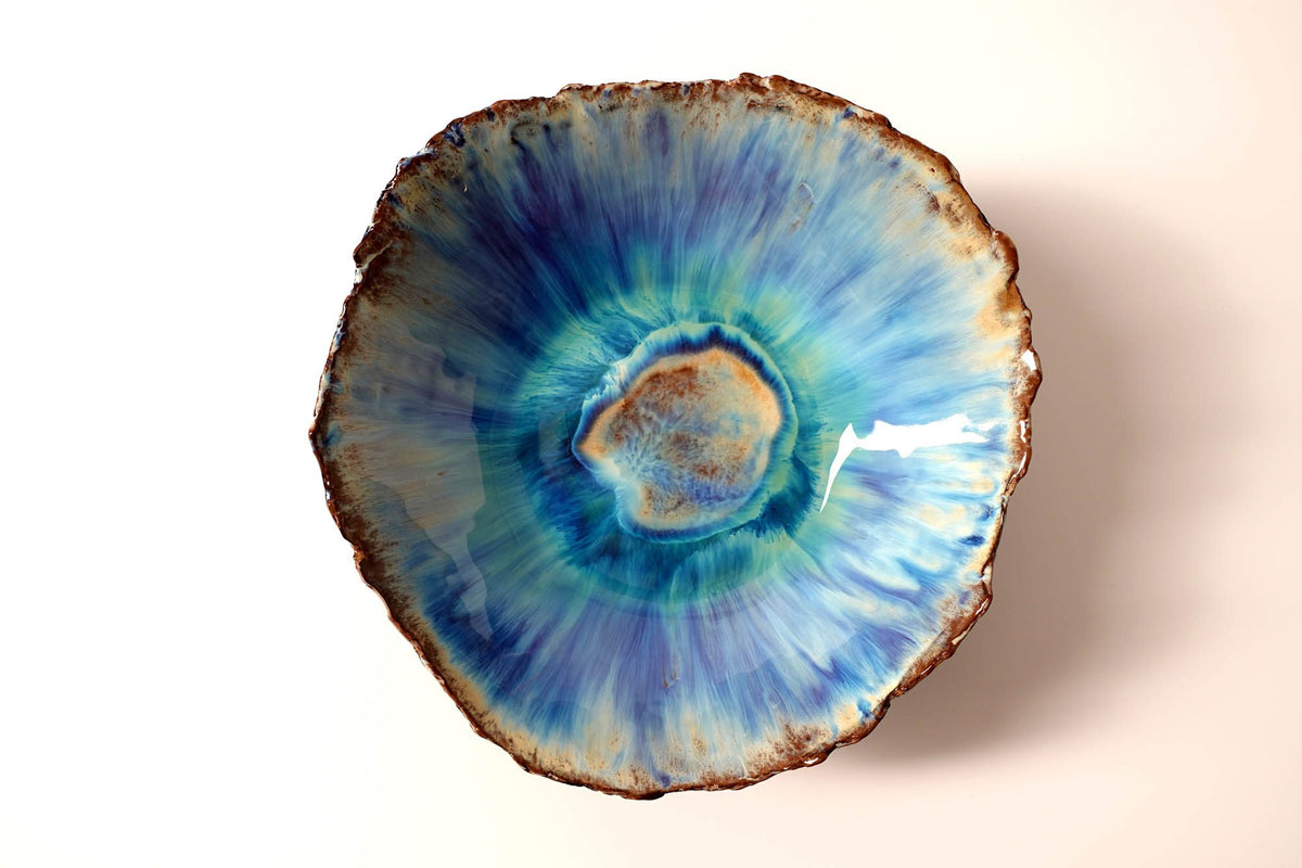 Custom porcelain bowl with reactive blue and turquoise glaze made for Chef Bruno Verjus