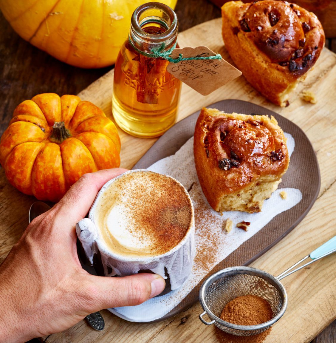 Gaz Oakley's pumpkin latte and cinnamon buns served on a handmade ceramic plate