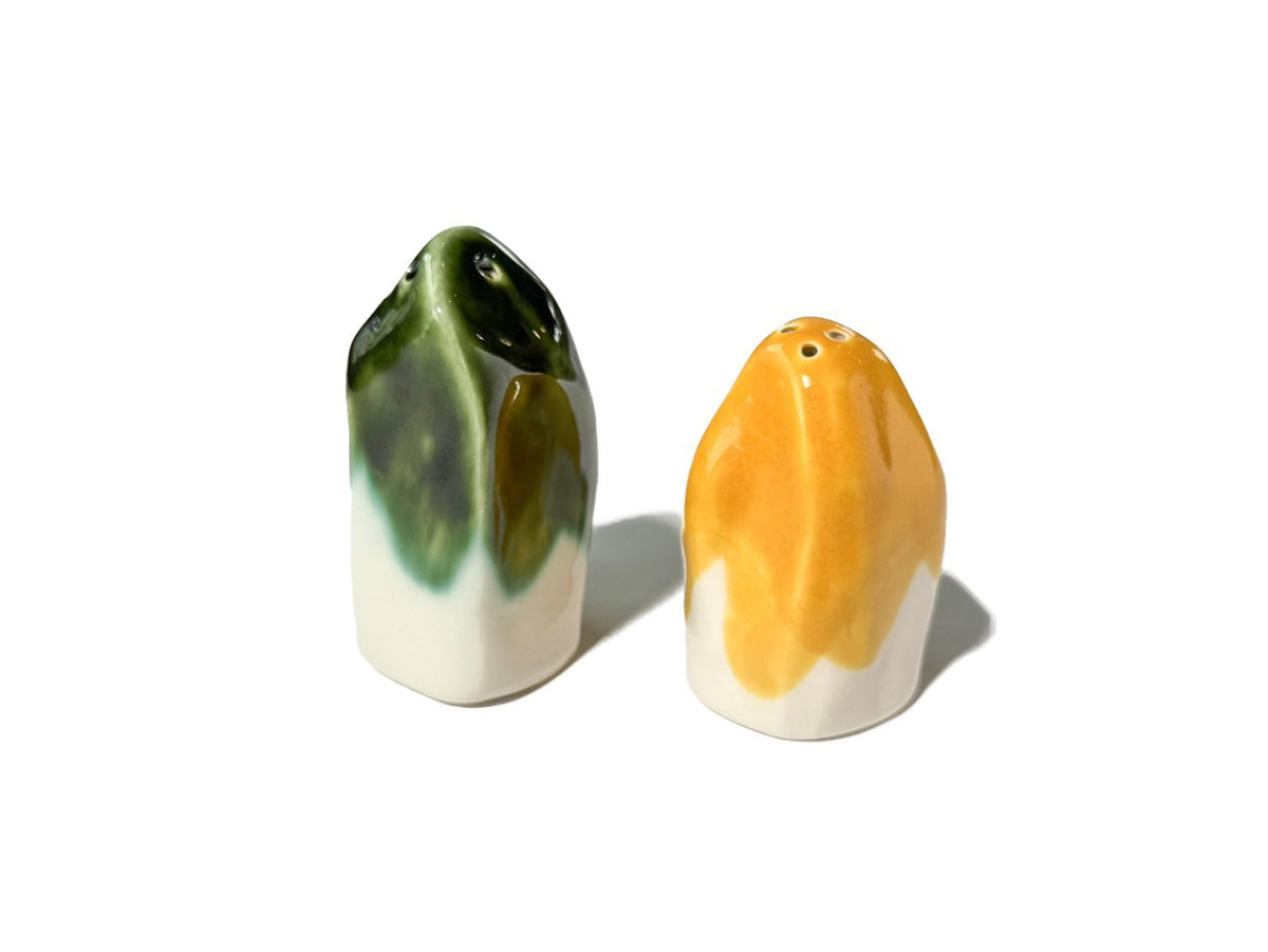 Handmade salt and pepper shakers with olive-green and yellow glaze patches