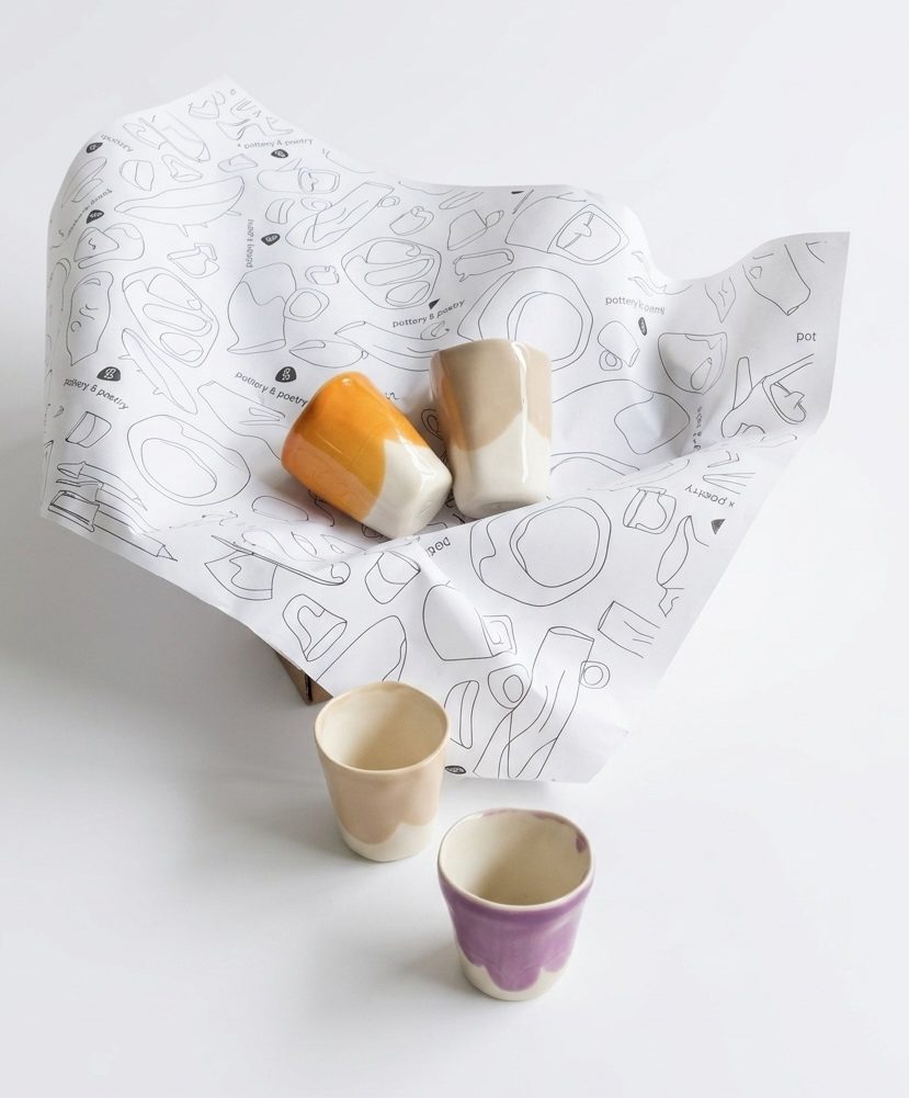 Set of 4 Espresso Cups in orange, ivory and lavender glazes with patterned wrapping paper