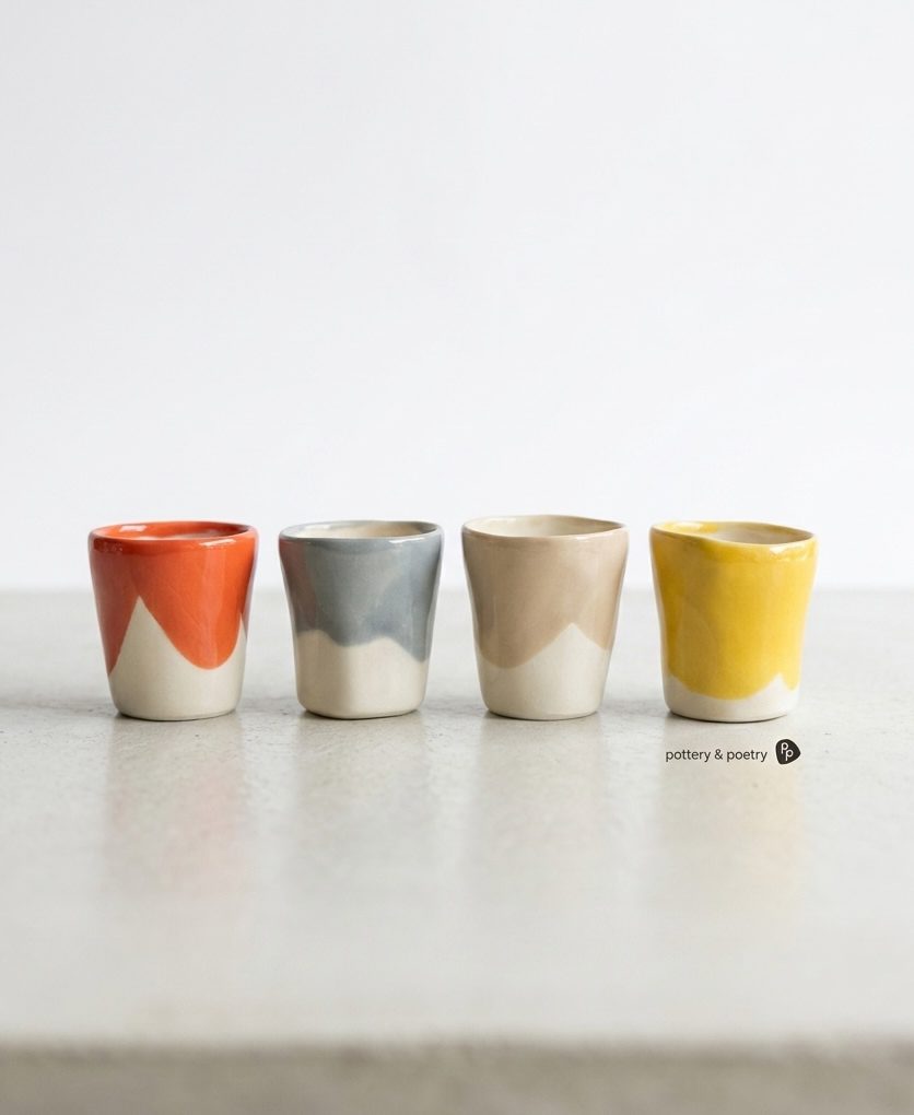 Set of 4 Espresso Cups in coral, grey, beige and yellow glaze with raw porcelain bases
