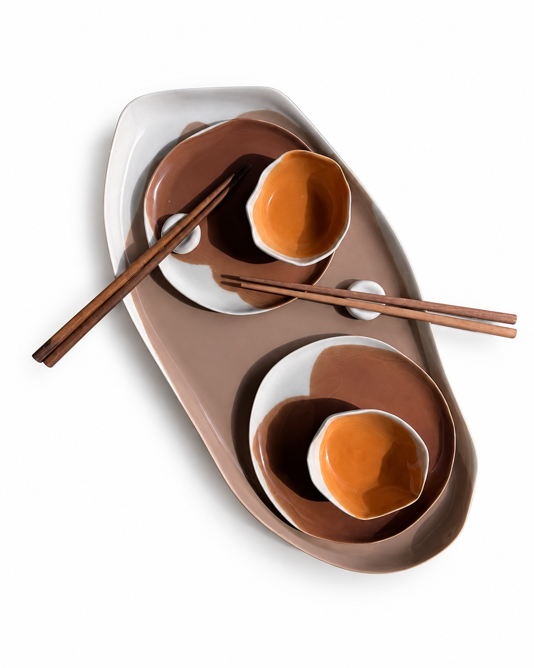 Brown, ivory and orange ceramic sushi set with a serving platter and chopsticks