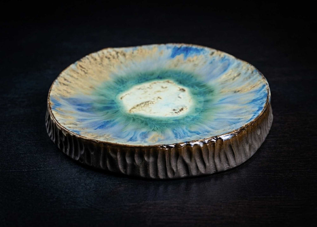 Textured Plate from Black Clay with a turquoise and ivory glaze centre and carved dark sides