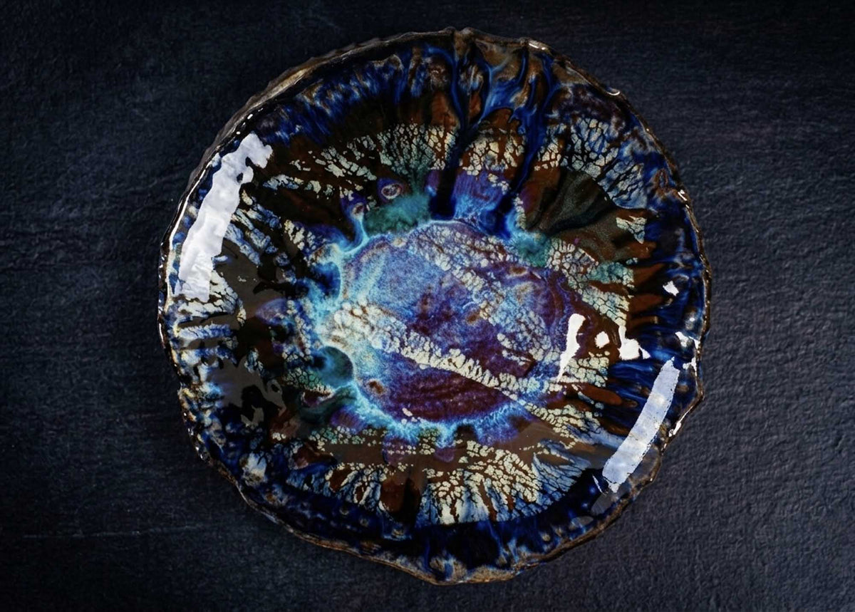 Textured Plate from Black Clay with dark blue and violet glaze and crackled bronze edges