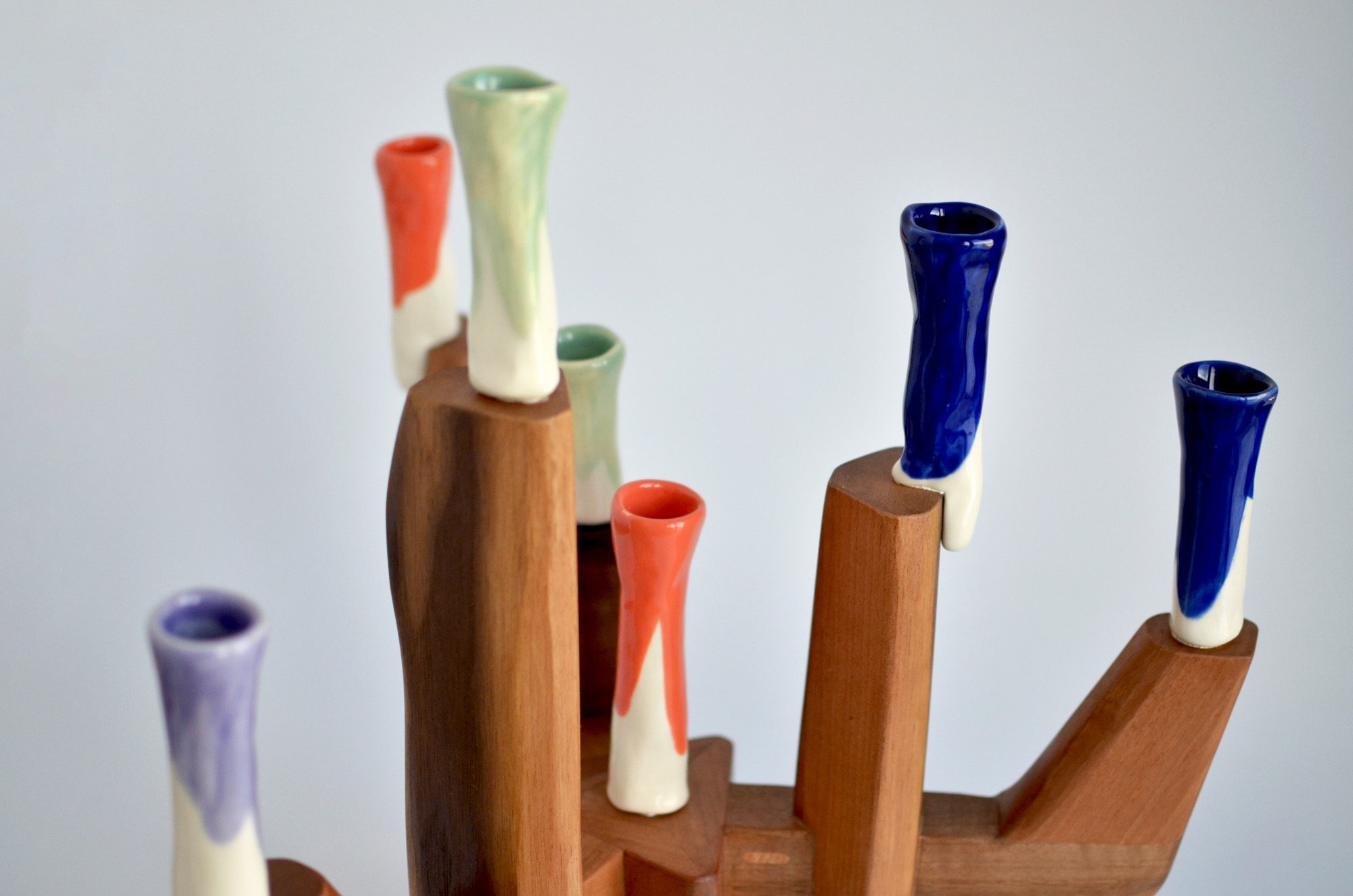 walnut wood and colorful porcelain candelabra