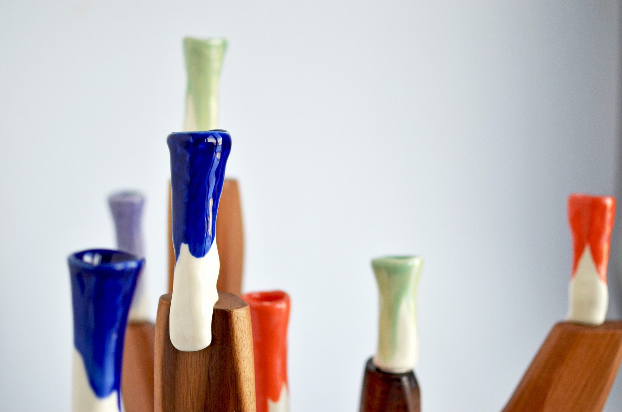 walnut wood and colorful porcelain candelabra