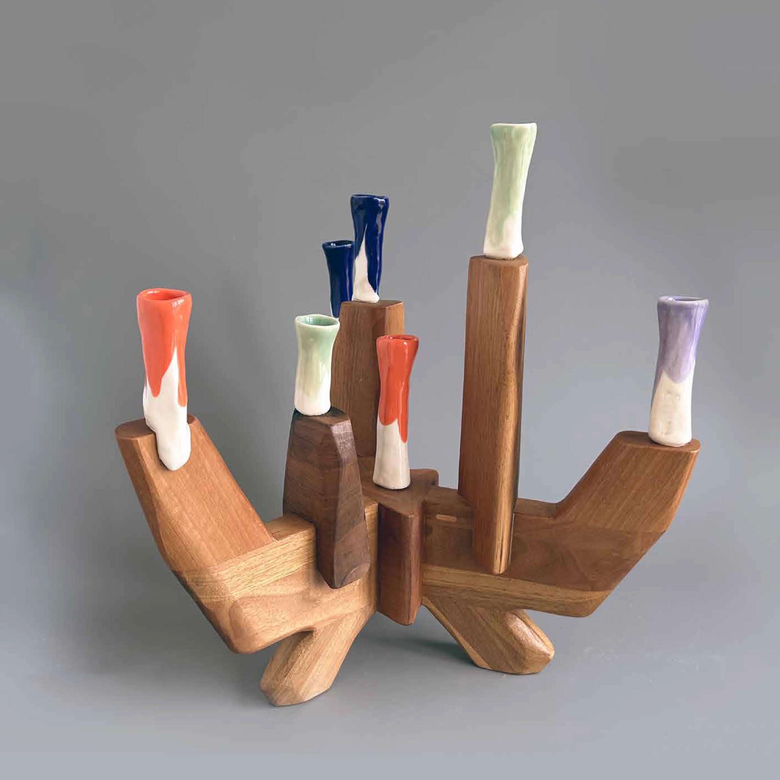 walnut wood and colorful porcelain candelabra