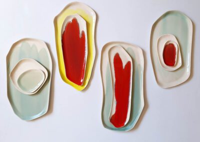 Handmade porcelain serving platters in various organic shapes and sizes.