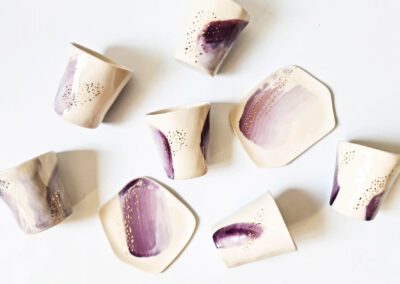 porcelain cups with purple and gold splashes
