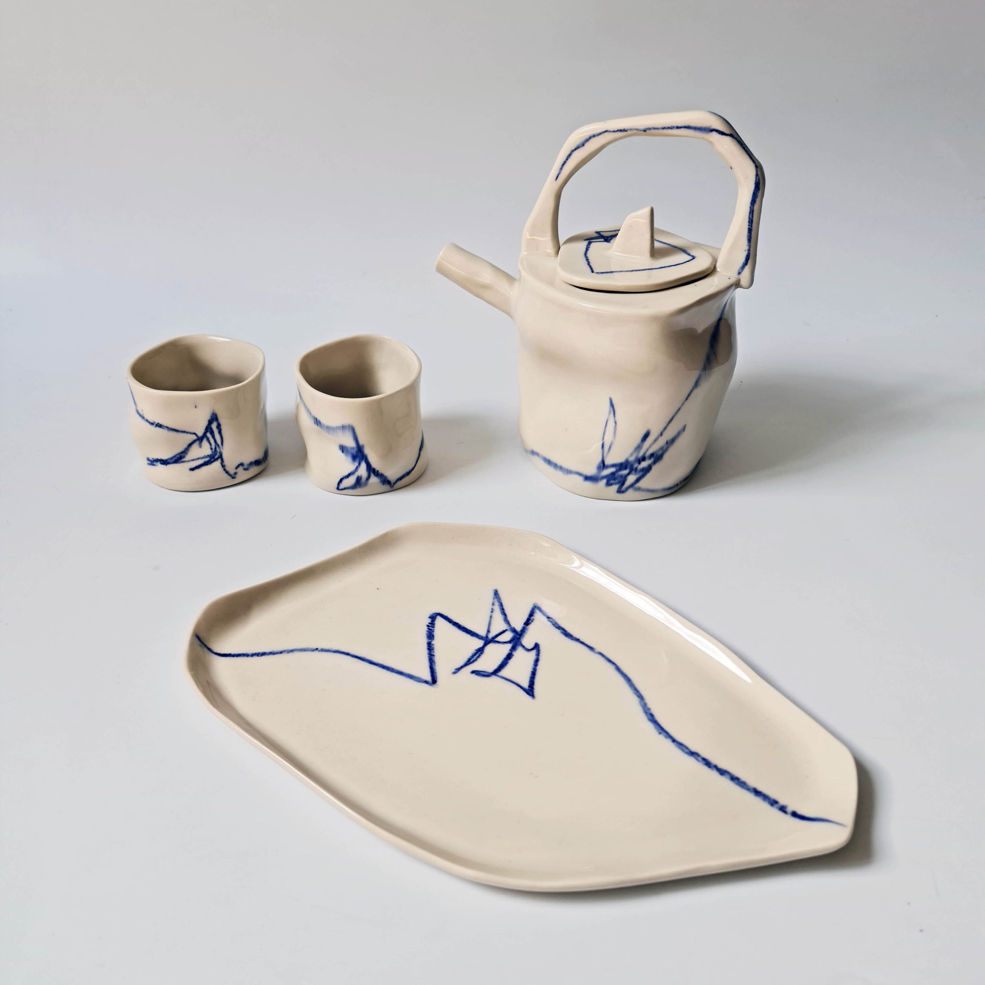 indigo-teapot-set porcelain tea set with blue graphics<br />
